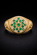 Rosette-shaped ring with green emerald stones in 10K gold